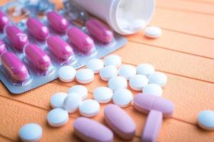 colorful pills and tablets on background