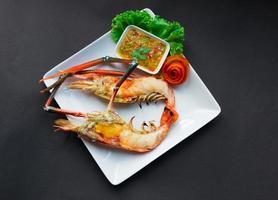 Grilled Giant River Prawn on black background photo