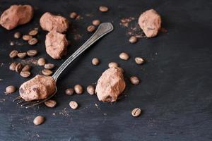 Chocolate truffles in an unusual shape with metal cutlery