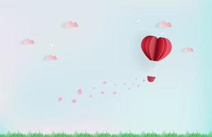 globo volando en el cielo con corazones rosas y nubes vector