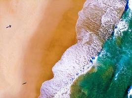 Top view of two people on the beach photo