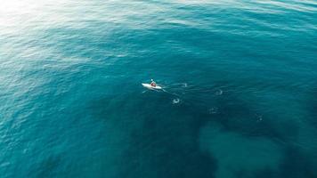 Man rowing on the sea photo