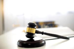 Gavel on desk in bright room photo