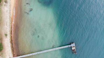 Wooden pier at the Pacific Ocean photo