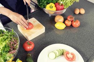 Home cook cutting vegetables