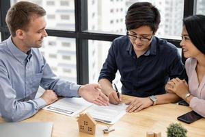 Couple in transaction with broker photo