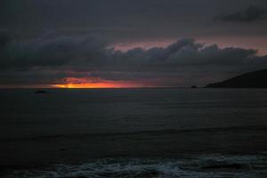 Body of water under cloudy sky  photo