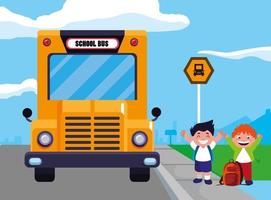 dos niños felices en la parada del autobús escolar vector