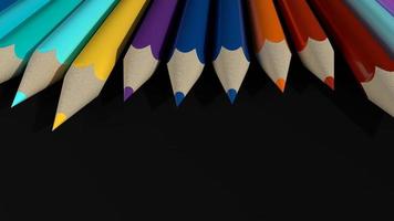 Colorful pencils on black background photo