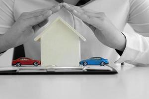 Red and blue cars with wooden house photo