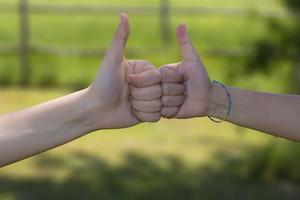 Two hands give a thumb's up photo
