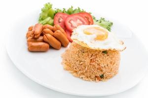 Plate with fried rice and egg with sausage and sides photo