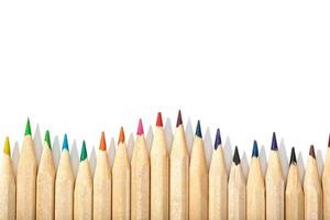Border of colored pencils on a white background photo