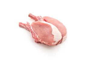 Raw pork chop on white background photo
