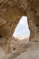 Sandstone arch in the desert photo