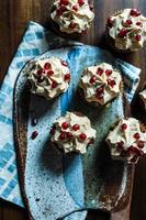 Cupcakes with pomegranate seeds photo