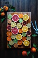 Citrus on cutting board photo