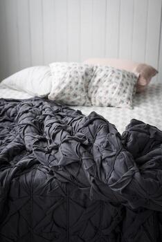 Gray tufted comforter photo