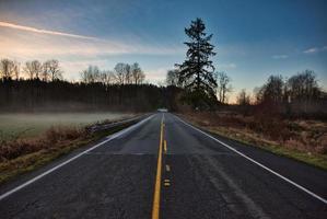 Highway beside mountain photo