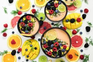 Assorted fruits In bowls photo