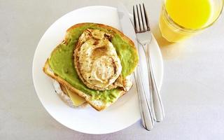 Top view of avocado toast with an egg photo