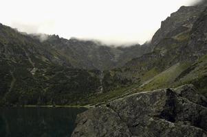 Foggy mountain lake photo