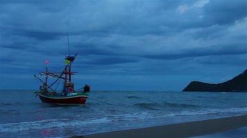 Coastal fishing boats floating; In stormy rains Thailand. video