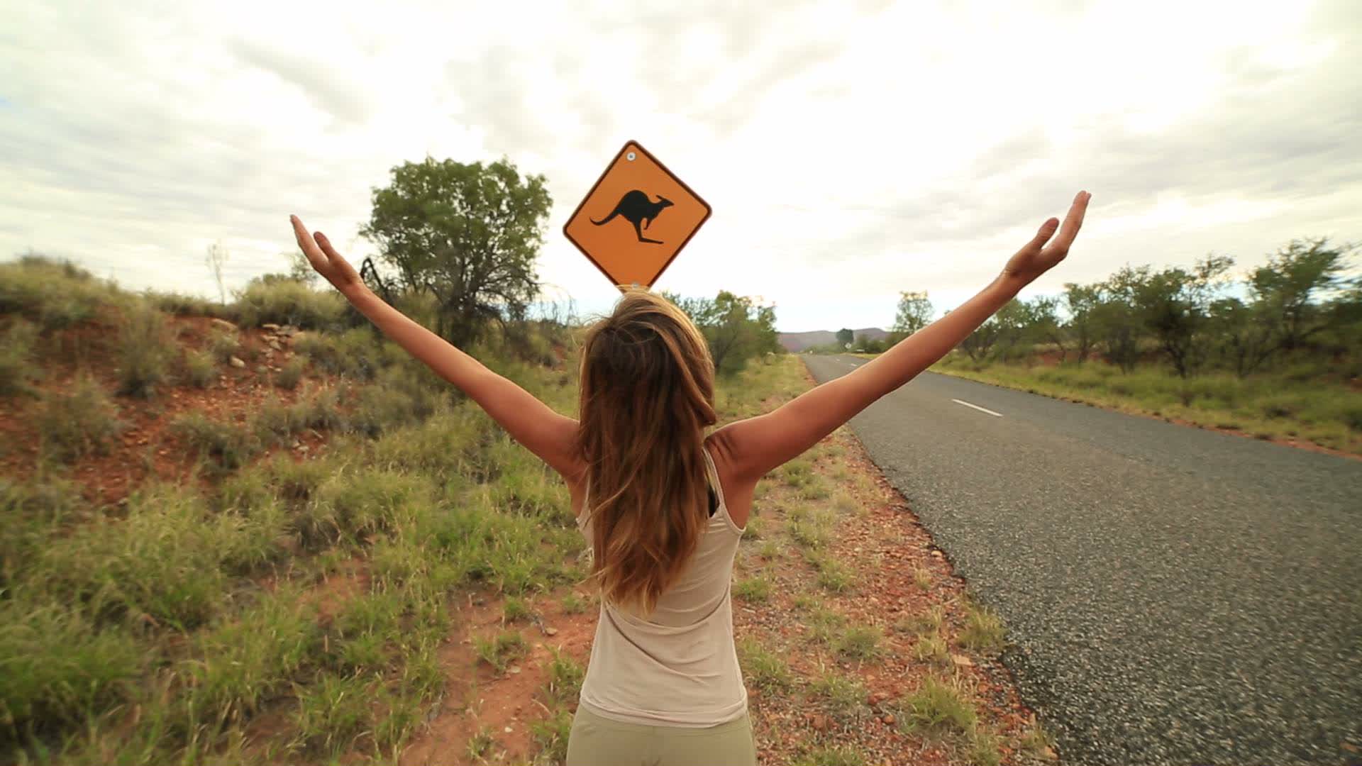Woohoo! Girl arms outstretched in Australia 1277094 Stock Video at Vecteezy