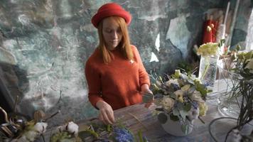 Florist girl making a flower composition video