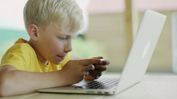 boy with phone and computer video