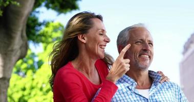 Portrait of mature couple is looking something and laughing video