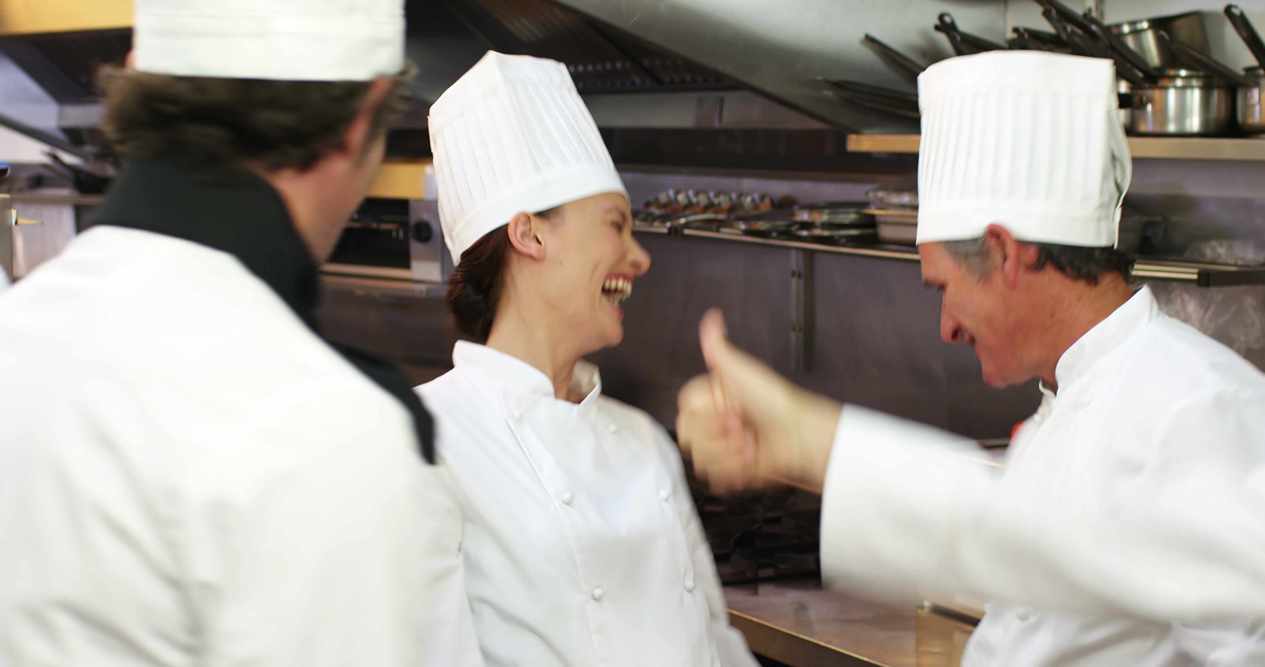 Group of chefs cheering and putting their hands together 1281116 Stock