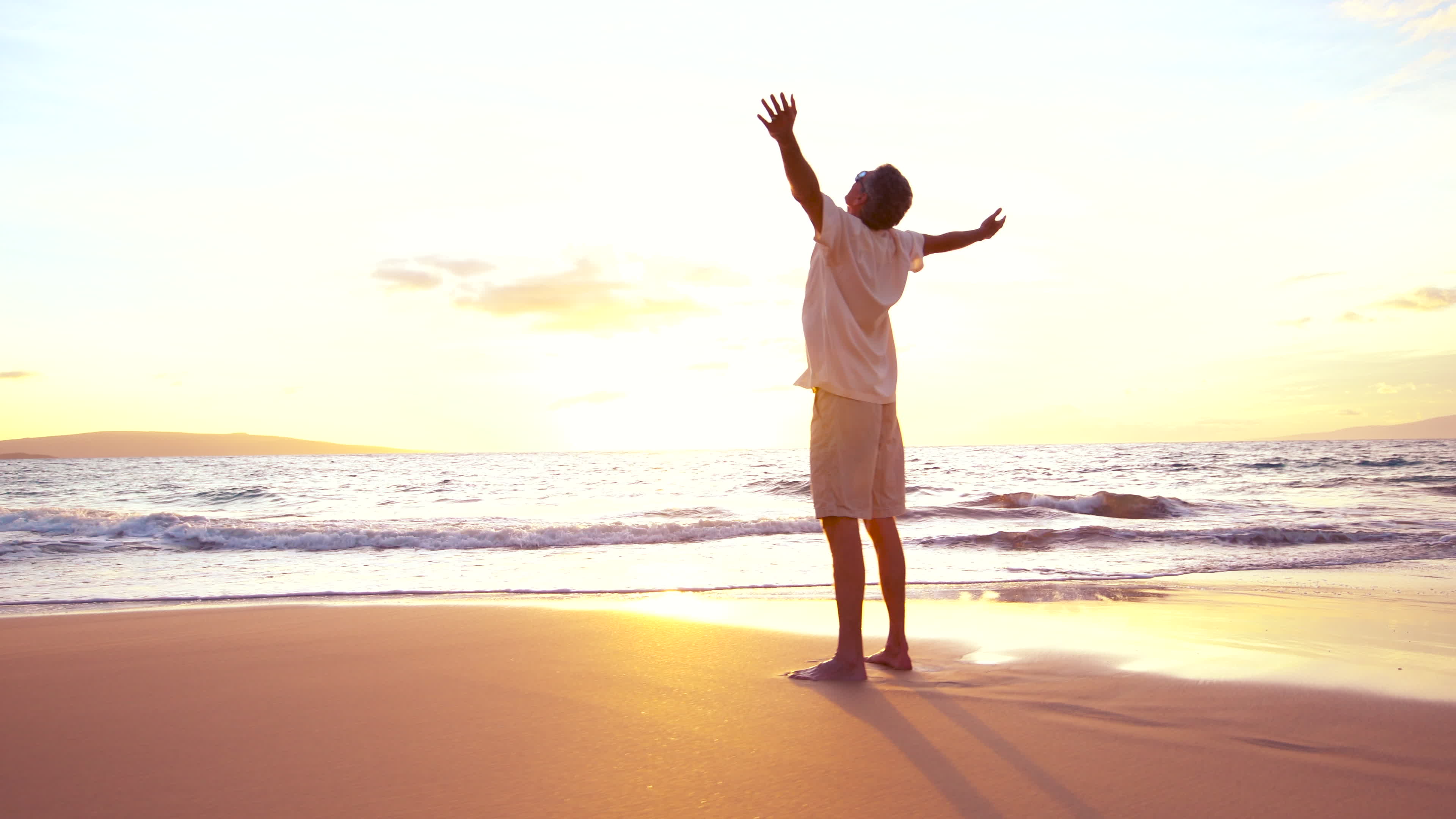 Freedom at the Beach. Mature Retired Man Having fun at Sunset 1281858 Stock Video at Vecteezy