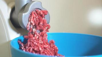 Woman Making Mince In The Kitchen With Meat Grinder. 4K video
