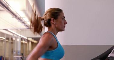 Super fit woman running on the treadmill video