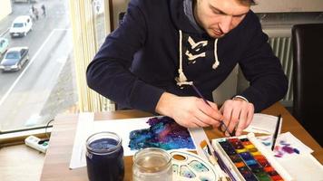 Artist working on painting video