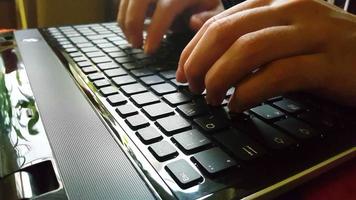 Hands typing on keyboard video