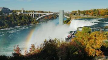 The observation deck near the famous Niagara Falls. Tourists admire the breathtaking sight video