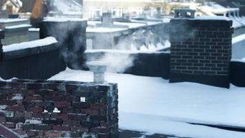 chimney blowing smoke in the winter