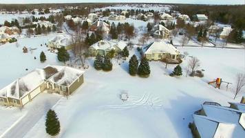 Winter flyover of wealthy suburban neighborhood homes video