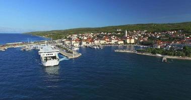 Aerial view of ferry leaving port in Supetar, Croatia