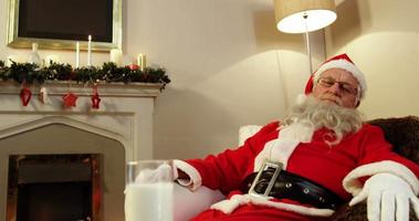 Santa claus relaxing and sleeping video