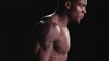 Muscular black man jumping rope video