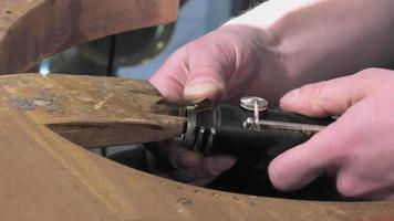 a craftsman repairing an old clarinet video