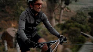 Active adult cyclist ready for the road with all his protective wear video