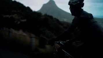 Side shot of cyclist in motion silhouette video