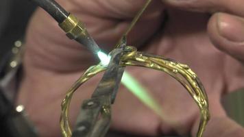 a jeweler creates a bracelet video