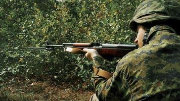 Gun Shot, Soldier Firing Large Caliber Rifle, Green Camouflage Uniform