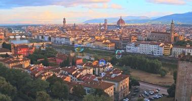 Aerial view of Romantic Florence, floating in the air colour bubbles, Italy video