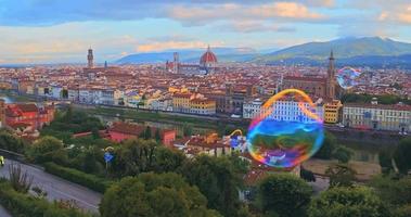 Aerial view of Romantic Florence, floating in the air colour bubbles, Italy video